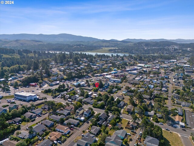 bird's eye view with a water and mountain view