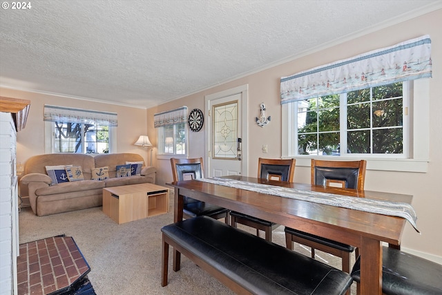 dining space featuring a textured ceiling and carpet floors