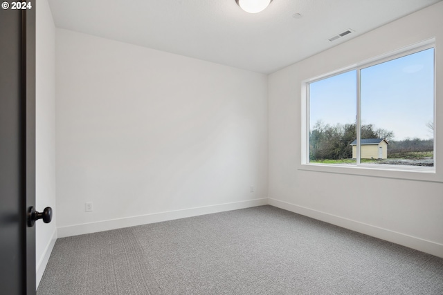 unfurnished room featuring carpet flooring