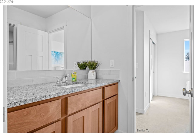 bathroom featuring vanity and baseboards