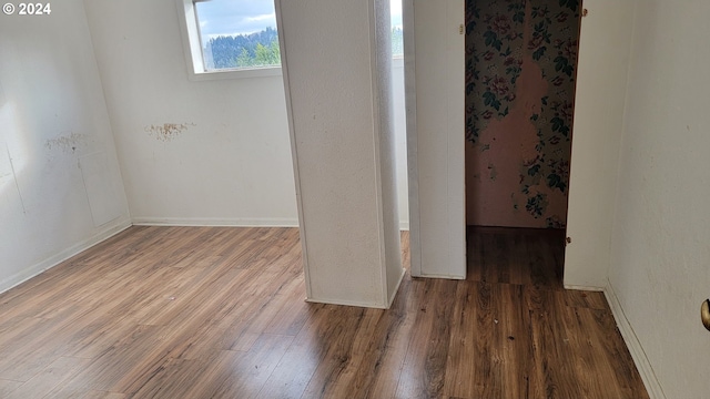 unfurnished room featuring hardwood / wood-style floors