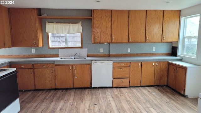 kitchen with white appliances, light hardwood / wood-style flooring, and sink