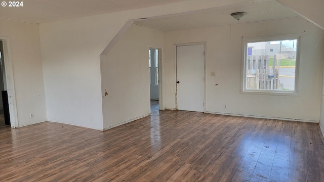 spare room with dark hardwood / wood-style flooring