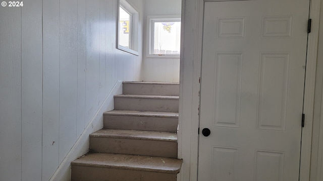 stairs with wood walls