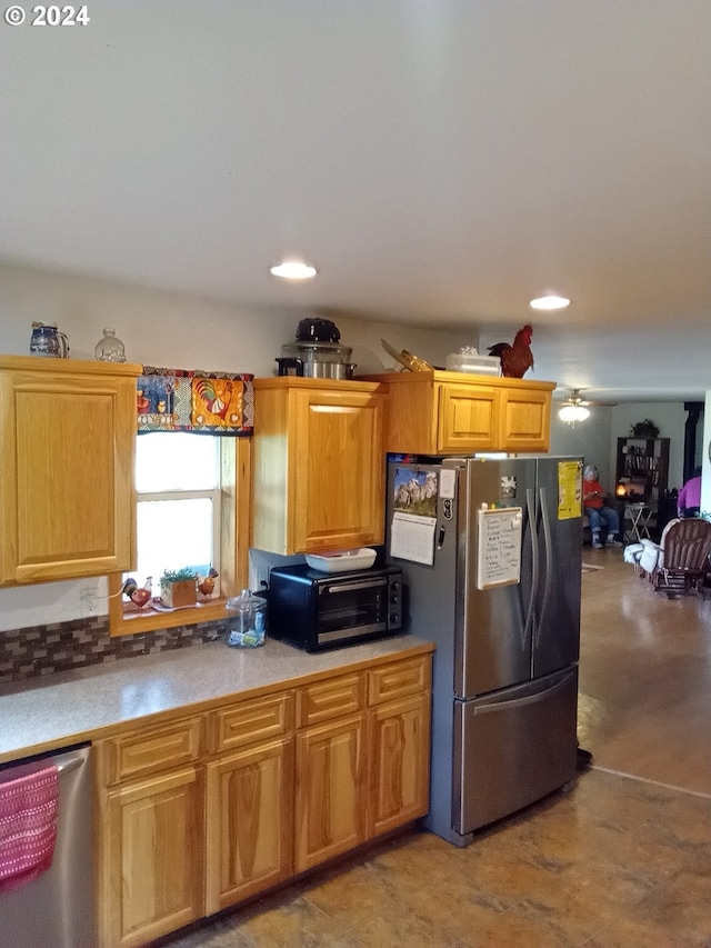 kitchen with ceiling fan and stainless steel appliances