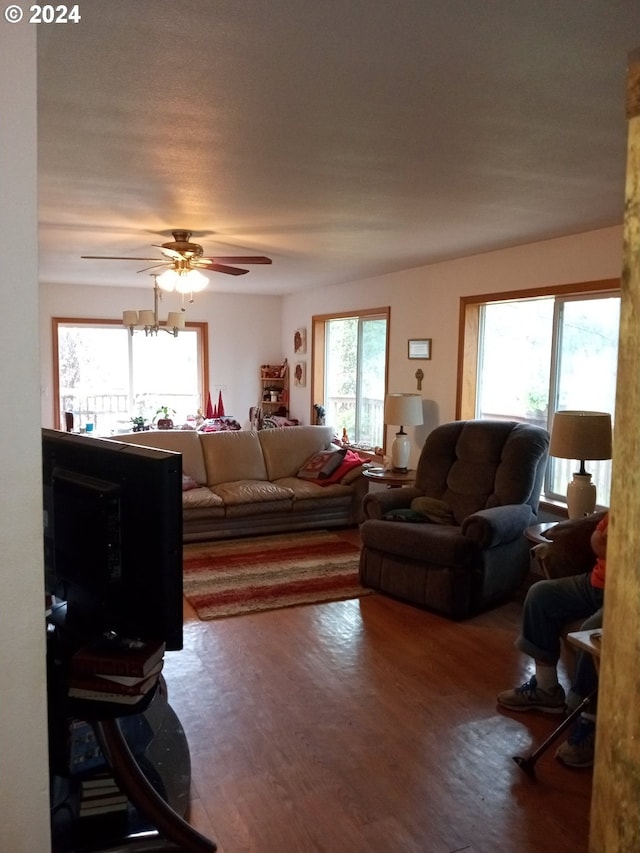 living room with hardwood / wood-style floors and ceiling fan