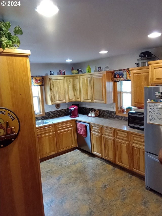 kitchen featuring stainless steel appliances and sink