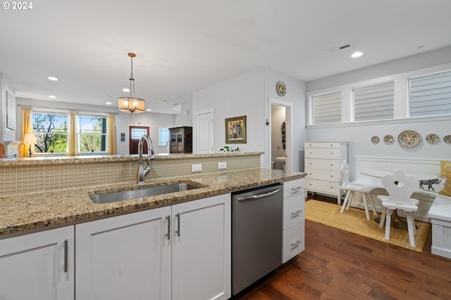 kitchen featuring dishwasher, white cabinets, and sink