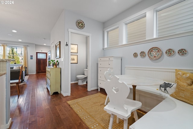 office with dark hardwood / wood-style flooring