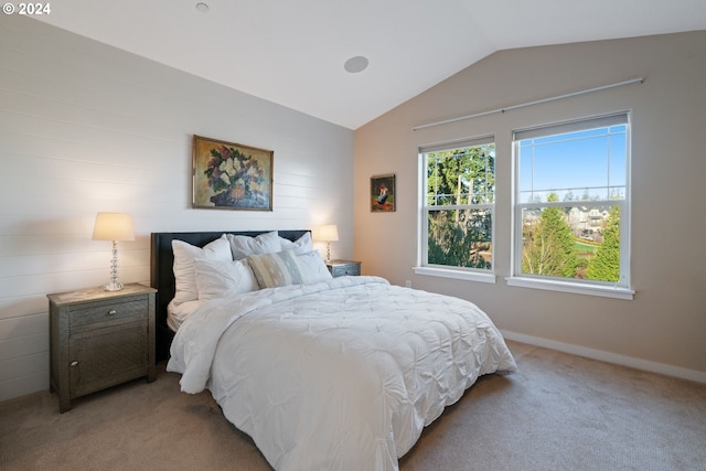 carpeted bedroom with vaulted ceiling