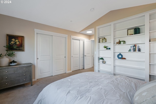 bedroom featuring light carpet and vaulted ceiling