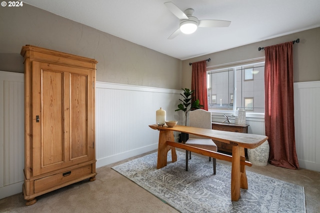 home office with ceiling fan and light colored carpet