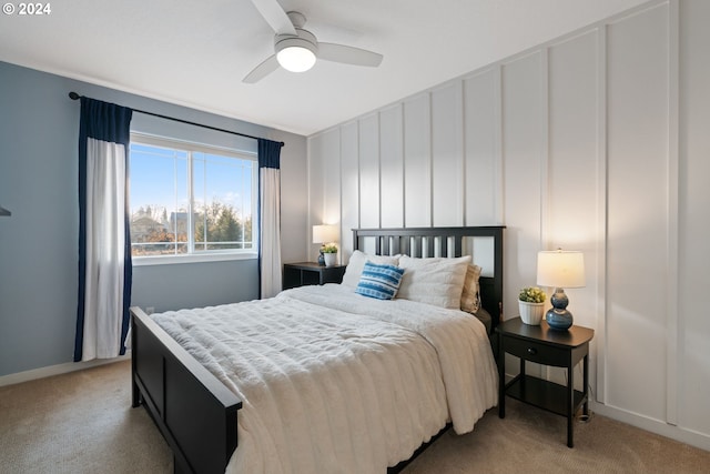 bedroom featuring ceiling fan and light carpet