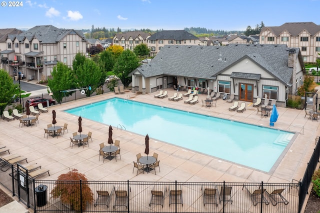 view of swimming pool featuring a patio area