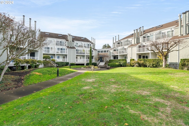 view of community featuring a lawn