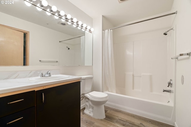 full bathroom featuring toilet, vanity, shower / bath combo, and hardwood / wood-style flooring