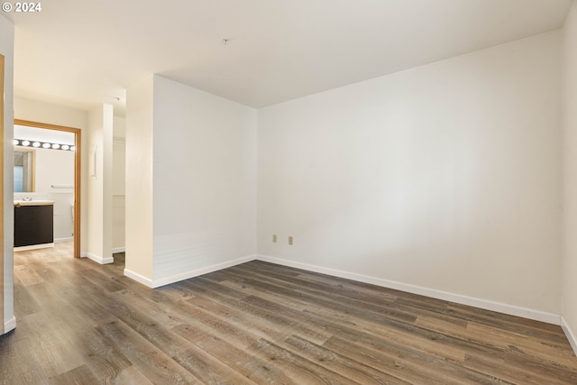 spare room with dark hardwood / wood-style floors