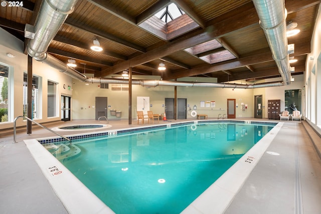 view of pool with a skylight