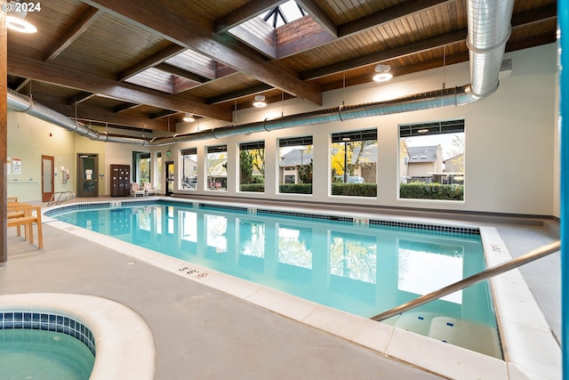 view of swimming pool with a skylight