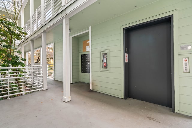 view of patio / terrace with covered porch and elevator