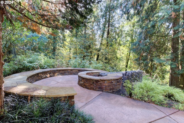 view of patio / terrace featuring an outdoor fire pit