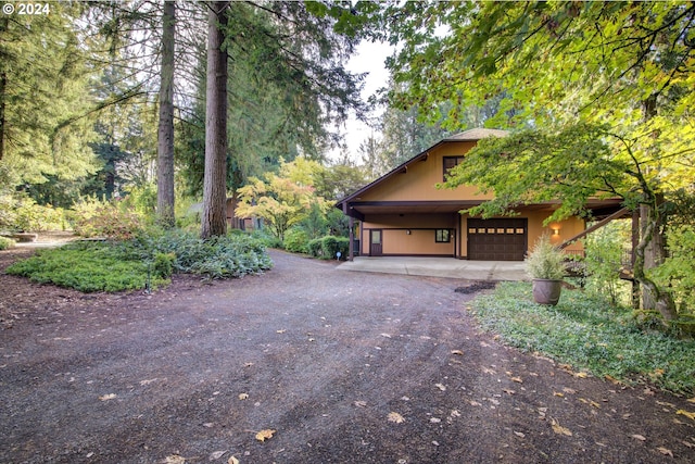 view of side of property with a garage