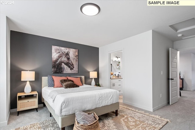 bedroom with carpet flooring and ensuite bath