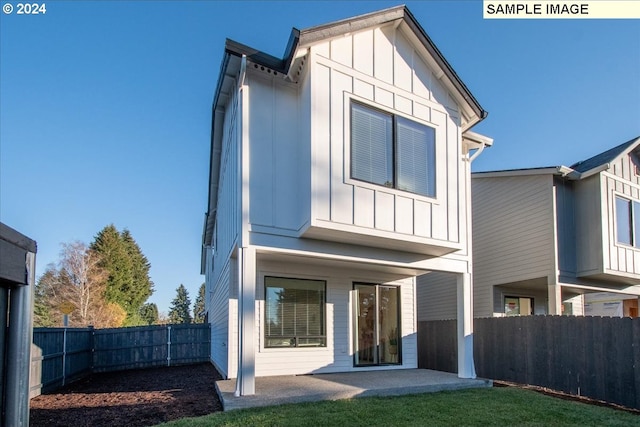 back of property featuring a patio area