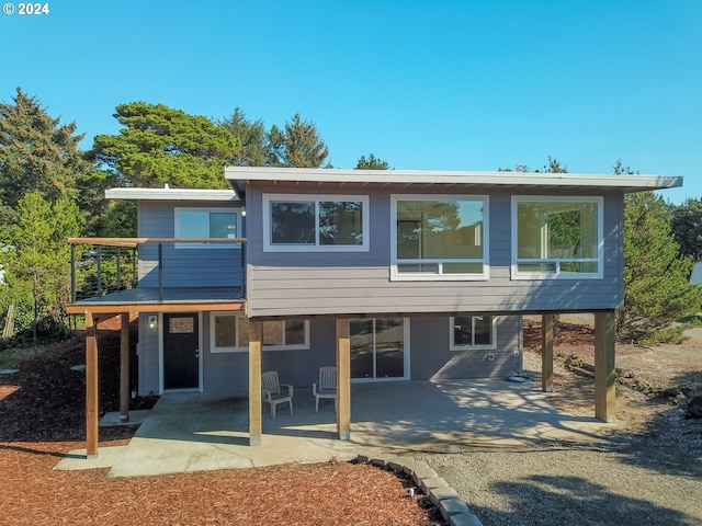 rear view of house featuring a patio area