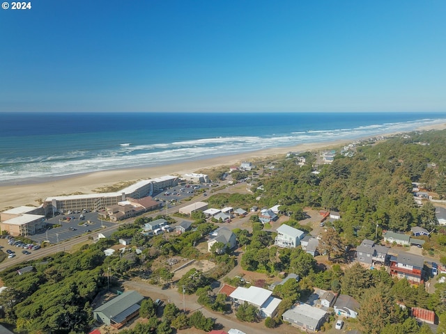 bird's eye view featuring a view of the beach and a water view