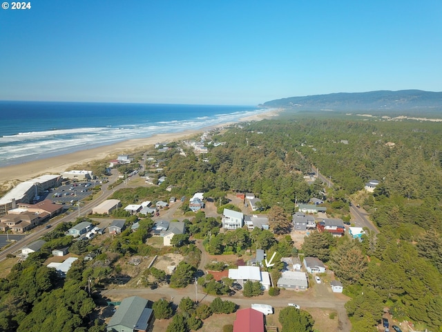 aerial view featuring a water view and a beach view