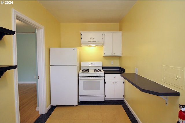 kitchen featuring white cabinets and white appliances