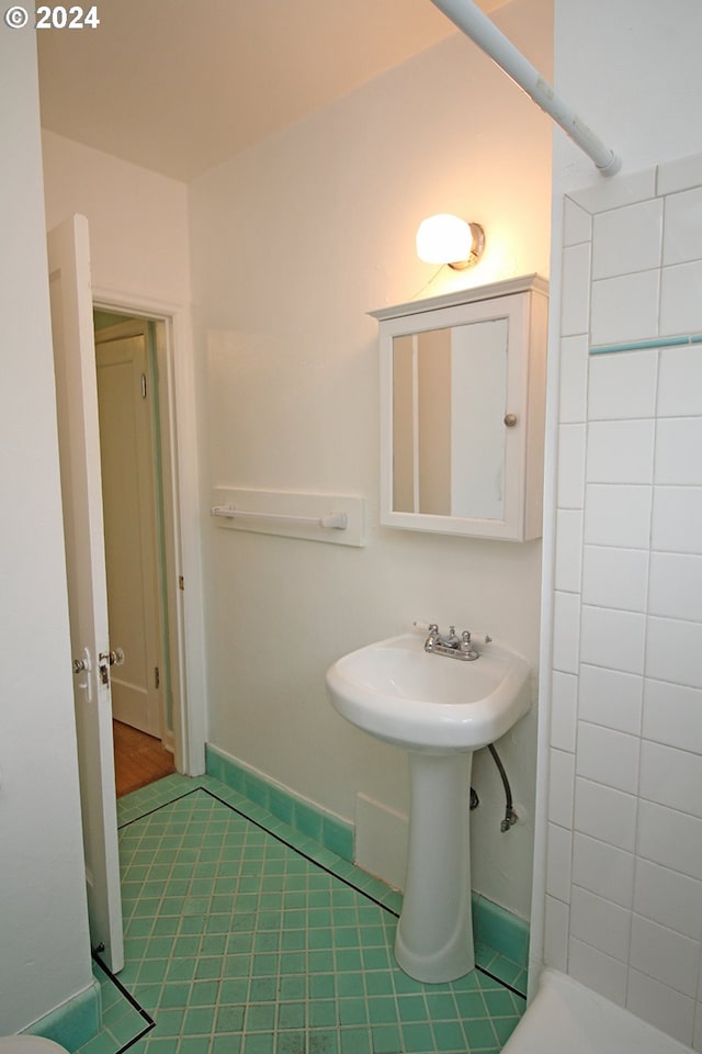 bathroom with tile patterned floors