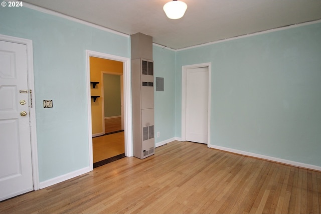 spare room featuring light hardwood / wood-style flooring