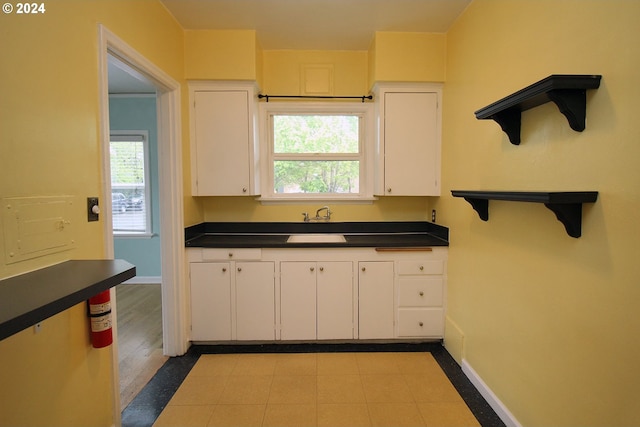 kitchen featuring white cabinets