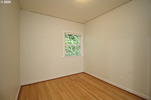 unfurnished room featuring hardwood / wood-style floors