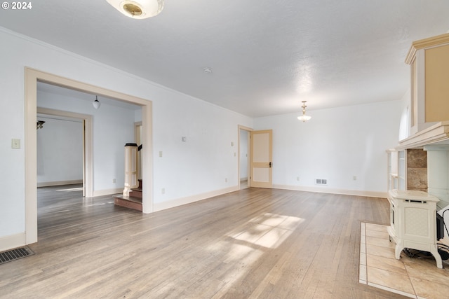 170 N Jefferson St, Eugene, OR 97402 - unfurnished living room featuring light wood finished floors and ornamental molding