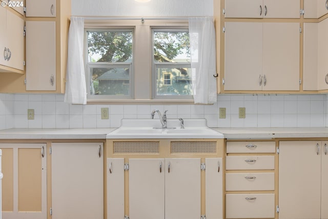 kitchen with sink and backsplash