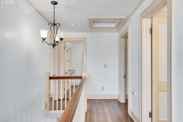 170 N Jefferson St, Eugene, OR 97402 - corridor featuring dark wood finished floors, an upstairs landing, and a chandelier