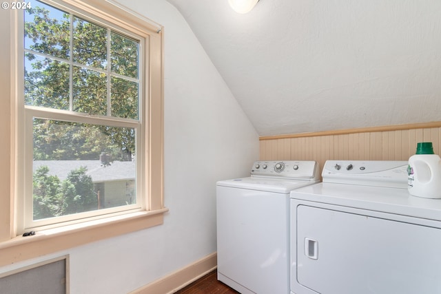 laundry room featuring dark hardwood / wood-style flooring and washing machine and clothes dryer