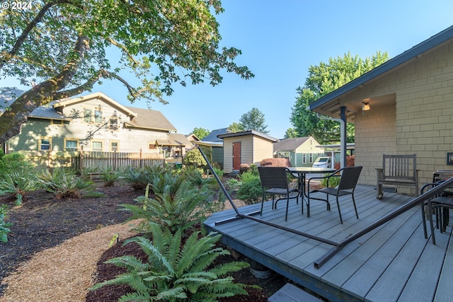 170 N Jefferson St, Eugene, OR 97402 - wooden deck featuring outdoor dining space and an outdoor structure