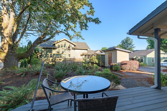 wooden terrace with a storage unit