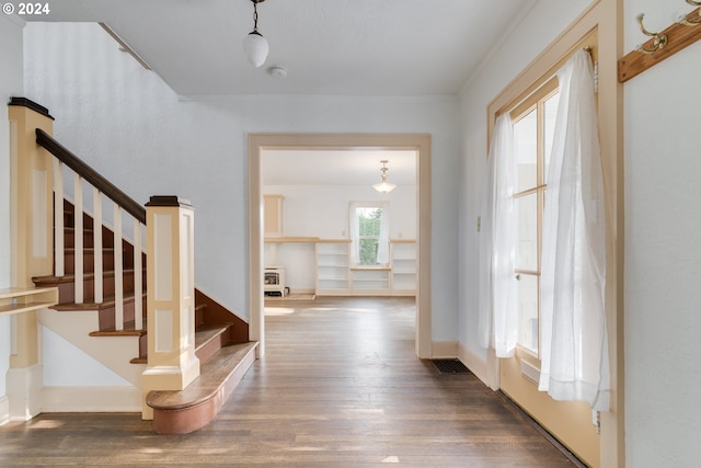 corridor with dark hardwood / wood-style floors