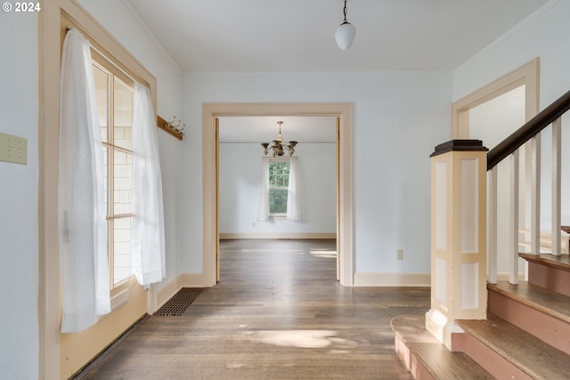 170 N Jefferson St, Eugene, OR 97402 - foyer entrance featuring a chandelier, wood finished floors, stairway, and crown molding