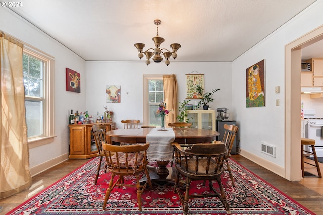 170 N Jefferson St, Eugene, OR 97402 - dining room with a chandelier and wood finished floors
