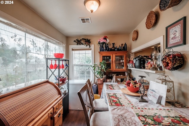 dining space with dark wood-type flooring