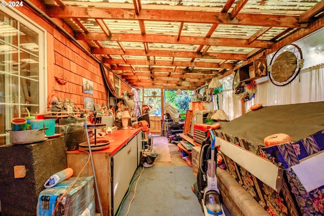 interior space with a workshop area and wooden walls