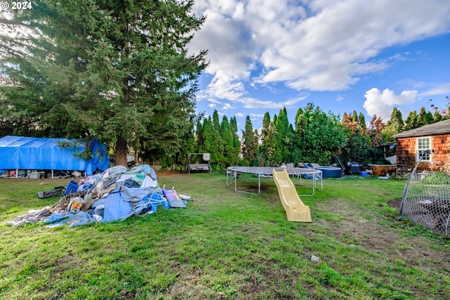 view of yard with a trampoline