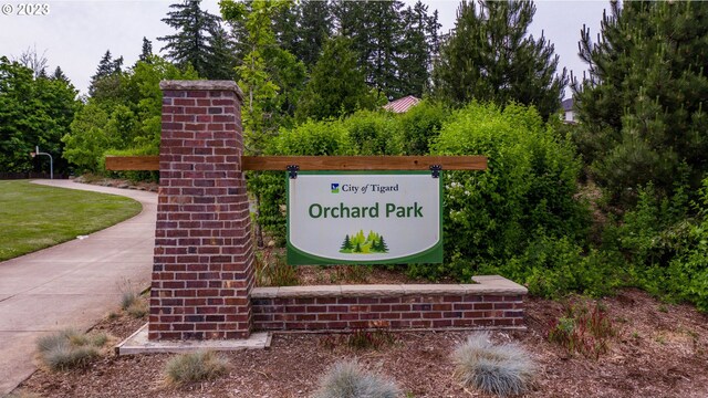 surrounding community with a lawn and a mountain view