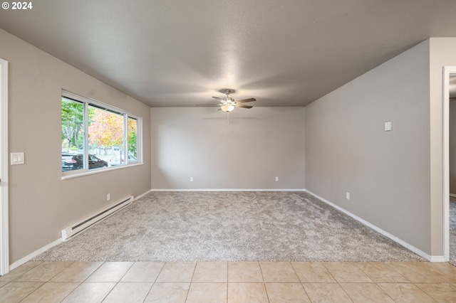 unfurnished room featuring light carpet, baseboard heating, and ceiling fan